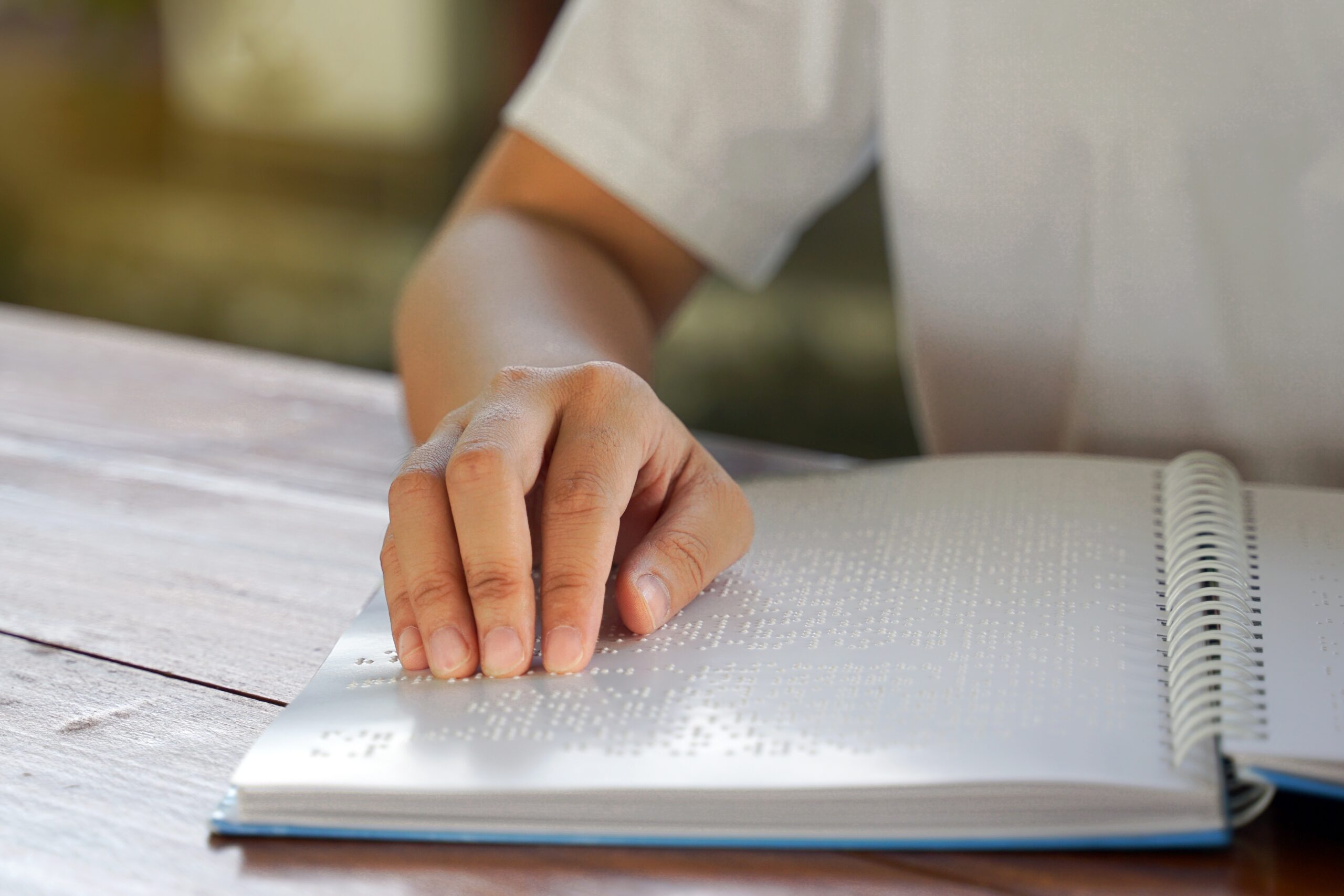 Visually Impaired Person, eads With His Fingers A Book